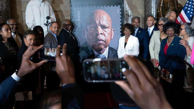 Members of the Congressional Black Caucus poses for a picture during the stamp unveiling ceremony in honor of Rep. John Lewis on Capitol Hill, Wednesday, June 21, 2023, in Washington. 